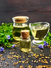 Oil flaxseed on dark board