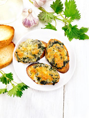 Sandwich of nettle in plate on board top