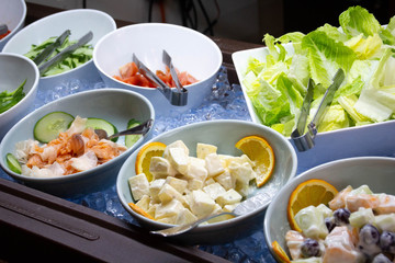 Image of a hotel buffet restaurant. Plate of many vegetables.