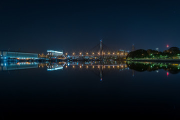 Mirror reflections of Anzac bridge at night in Sydney, Australia
