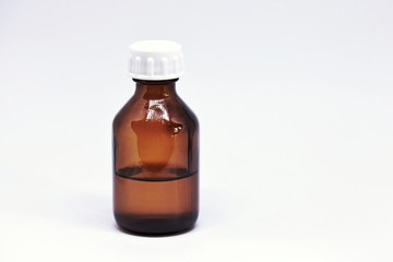 glass jar with liquid  medicine or oil