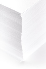 Stack of white office paper on light background, top view, place for text.