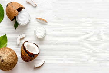 Homemade coconut cream on white wooden background top-down frame copy space