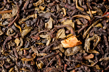 A mixture of black and green tea with vanilla-strawberry flavor, sliced strawberries and rose petals. Background for tea and antioxidants.