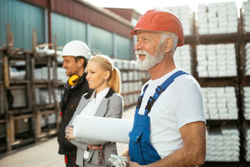 Colleagues working together. Worker in factory.