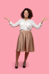 Smiling young woman standing with her eyes closed.