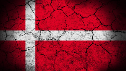 Denmark flag on the cracked background texture. 