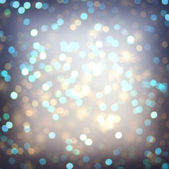 Blue bokeh on grey blur vintage background. Glitter vignette pattern.