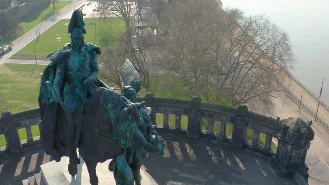 Deutsches Eck german corner in Koblenz with the monument statue of the Kaiser Emperor Wilhelm I with the river mosel aerial drone medium fly away shot shot Drohne, Luftaufnahme 4K 25p