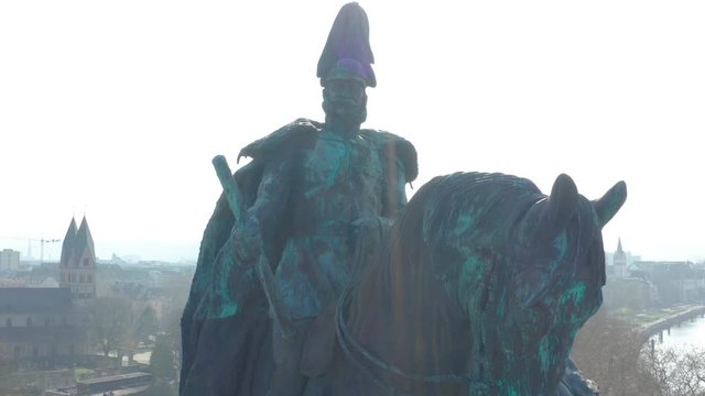 monument statue of the Kaiser Emperor Wilhelm I with koblenz in the background at the german corner, detusches eck aerial drone close up rotating shot shot, Luftaufnahme 4K 25p