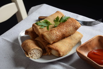 Cabbage rolls stuffed with ground beef and rice in tomato sauce