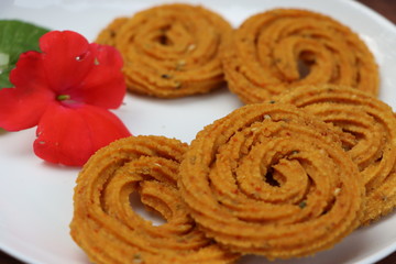 Indian Traditional Snack Chakali, a spiral shaped crisp deep fried snack, It is known as Chakali, Murukku, Muruku, Murkoo, Chakri in Gujarat, Chakli in Maharashtra, Indian festival or Diwali Snacks 