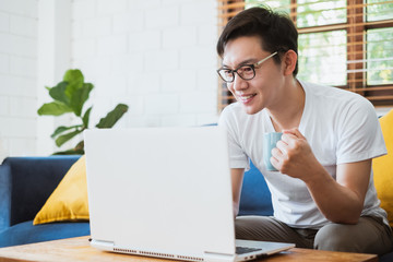 Work from home or work at home concept, asian man working with laptop computer due to quarantine...