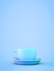 Blue tea mug with saucer on a blue background. With copyspace.