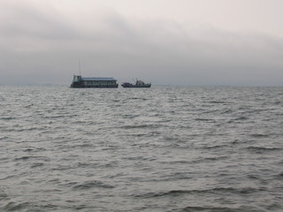 boat in the sea at sunset