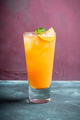 Fresh cocktail with vodka and orange juice on the rustic background. Selective focus. Shallow depth of field.