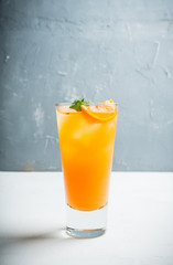 Fresh cocktail with vodka and orange juice on the rustic background. Selective focus. Shallow depth of field.