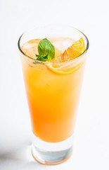 Fresh cocktail with vodka and orange juice on the rustic background. Selective focus. Shallow depth of field.