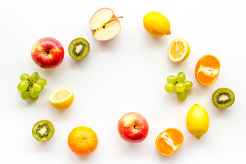 Colorful fruit mockup. Cut apple, kiwi, citrus on white background top-down copy space