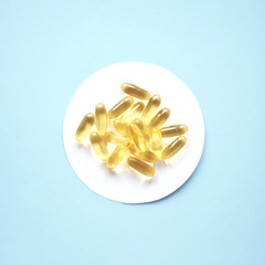 Fish oil capsules for health and beauty.
