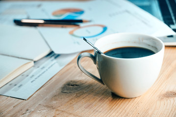Espresso coffee cup on working table.