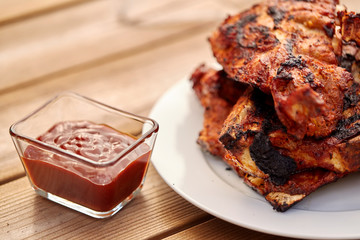 cooking, culinary and food concept - close up of grilled barbecue meat stack on plate