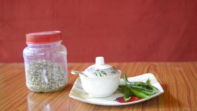 Mirch Masaala Green Chillies recipe. Food and drink. Health care and medical nutrition supplement. Home remedies. Healthy lifestyles. Red background.