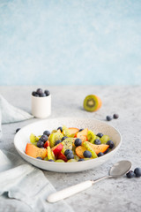 Fresh natural fruit salad bowl with Chia seeds