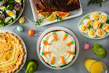 Big traditional Easter brunch with ham, quiche lorraine and carrot cake