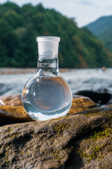 Glass flask with clean drinking water.
