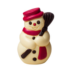 snowman made of white, dark and red chocolate in a hat and scarf with a broom. Isolated on white, no shadow.