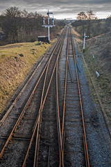 Fototapeta na wymiar Aerial view over railway tracks heading into distance