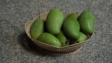 The Raw Mango in Basket