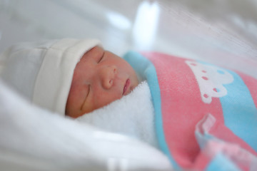 cute little newborn baby sleeping sweet dream in soft blanket