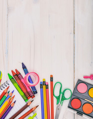 School supplies on wooden desk. Back to school concept.