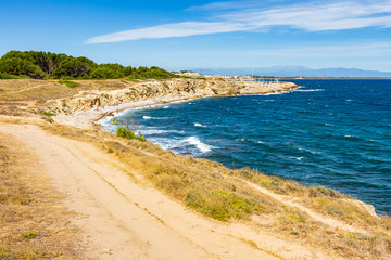 Naklejka na ściany i meble View of the coastal path that runs through the Montgri Natural Park. Costa Brava, Catalonia, Spain