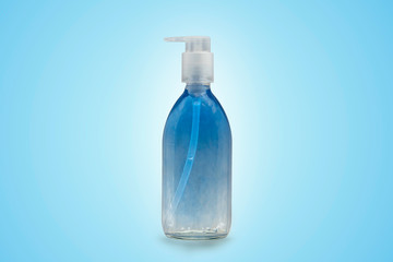 Blue and clear soap in a glass bottle with pump for cosmetic