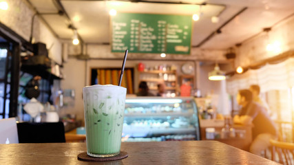 Green tea milk placed on the table in the cafe