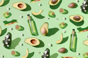 Fototapeta na wymiar Modern avocado pattern on a green background.