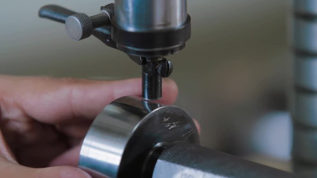 Quality Engineer Checks Deficiencies on the Injection Mold by a special equipment. Industrial equipment for testing the quality of metal parts