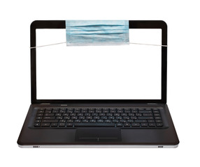 Laptop with a protective mask isolated on a white background, text frame, remote education, work at home, freelance, online shopping