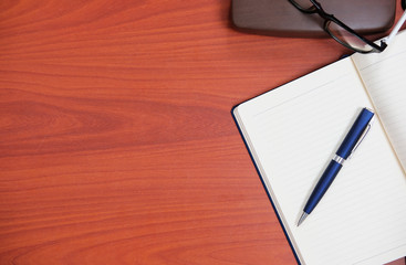 Home office table of laptop computer and blank paper background and copy space