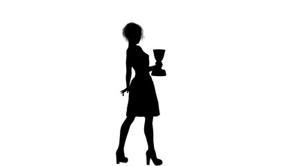 Black silhouette of one young girl in a dress that shows the winner's cup by turning sideways to the camera