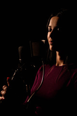 Professional musician recording new song in studio.