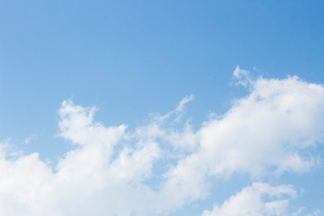 Bright blue sky with white clouds for background or wallpapers