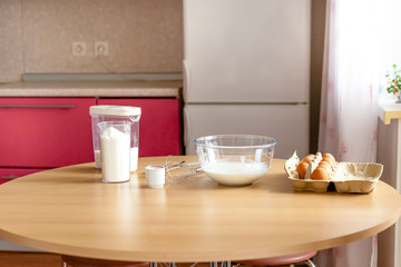 Kitchen and table, baking, bowls with flour, milk, sugar, delicious Breakfast for the family, cooking with children