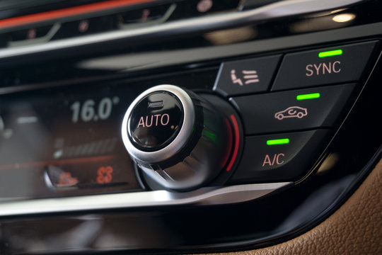 Selective Focus Of Vehicle Air Conditioning Control System. AC Recirculation Button On Dashboard In Luxury Car.