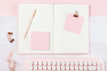 flat lay stationery on work desk in pink pastel background