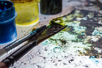 table and paint brushes, creative process