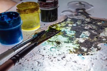 table and paint brushes, creative process